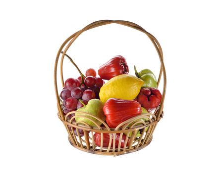 mixed fruits in rattan basket on white backgroundの写真素材