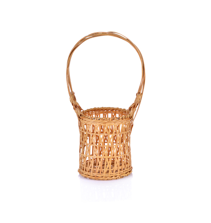 empty bamboo basket with handle on white backgroundの写真素材