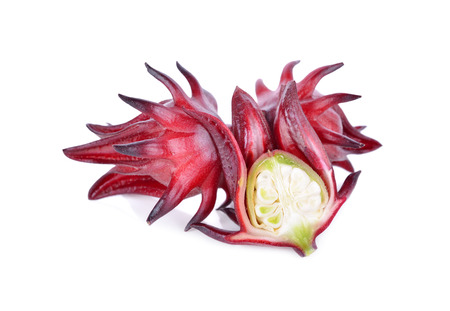whole and half cut fresh red roselle on white backgroundの写真素材