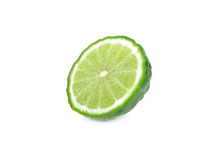 half cut fresh bergamot or kaffir on white backgroundの写真素材