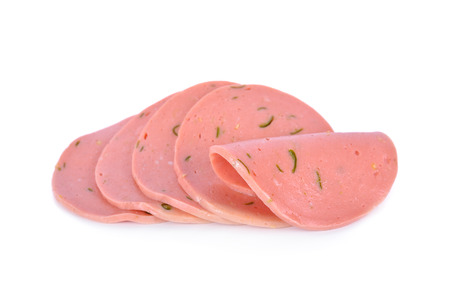 sliced boloney sausage with chili on white backgroundの写真素材