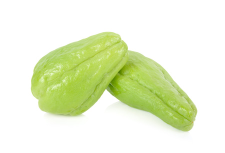 whole fresh chayote on white backgroundの写真素材