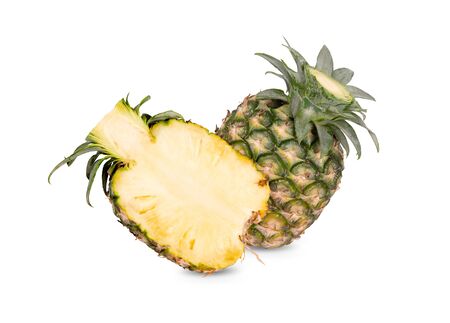 whole and half cut unpeeled ripe pineapple on white backgroundの写真素材