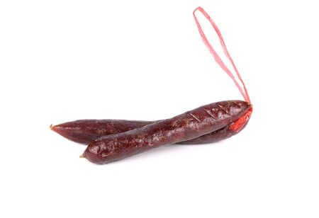 uncooked homemade dried sweet Chinese pork sausage with rope on white backgroundの写真素材