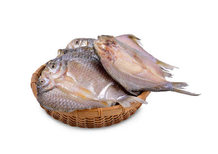 dried (one-sun) marinated butterfly silver barb in bamboo basket with white backgroundの写真素材