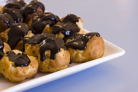 Profiteroles on a white plate
