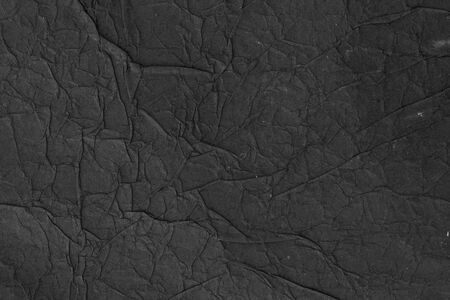 Black rice paper texture or background. Hand made rice paper with jams and bumps on the surfaceの写真素材