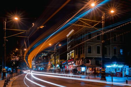 Night streets of Istanbul. Photo taken at a long exposure. Streets of the old city and lights of the evening city. A tram on the tracks at night.の写真素材