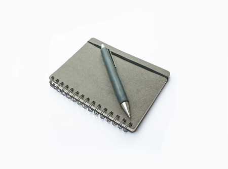 Blank note book with pencil isolated on white background