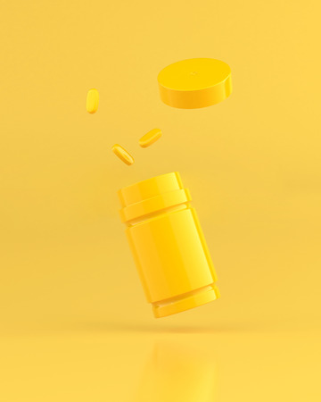 Yellow Pill and Bottle on Bright Yellow Background, Creative Idea and Pop Art concept.の写真素材