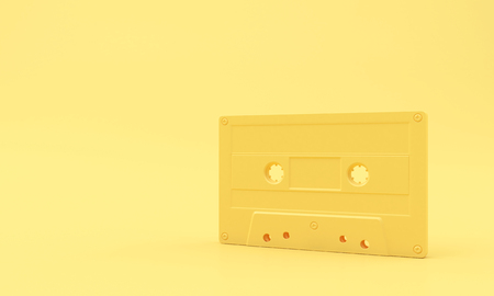 Yellow Cassette Tape on Yellow Background, copy space Minimal pastel.の写真素材