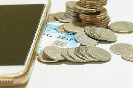 coin  and telephone is want for business growth in the Future, concept money coin isolated, white backgroundの写真素材