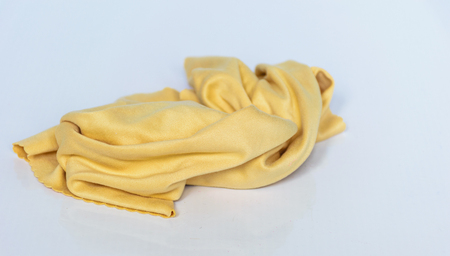 yellow rags background,concept be crumpled rags, white backgroundの写真素材