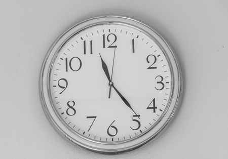 clock wall is isolated ,show number 1 -12 , white background of clock wall, white black image