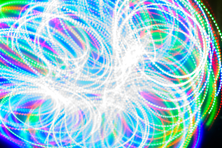 Color line's blurred Bokeh color with a beautiful,moving in dark, dark black background.