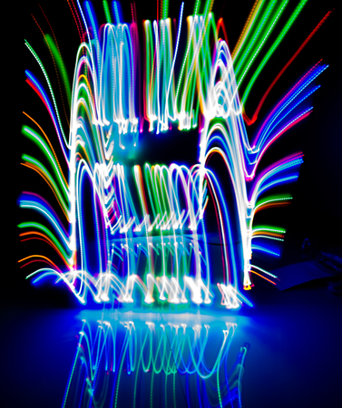 Color line's blurred Bokeh color with a beautiful,moving in dark out of the center, dark black background.の写真素材