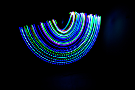 Several lines of light colored lines, beautiful and hurts is an interesting and exciting luai wire. There is a black or dark background, suitable for use as a backdrop.の写真素材