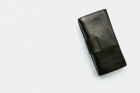 Storage saving with a dark black leather and white piggy bank.Represent the richness in the future.Concept image isolated white backgroundの写真素材