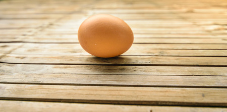 Fresh egg meals To make a breakfast.Have a high nutritional value,including high cholesterol has been put on the bamboo wooden table, look like natural.の写真素材