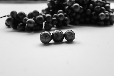 Purple grapes is isolated with white background, look liked fresh fruit for eating,high vitamins for Health.の写真素材