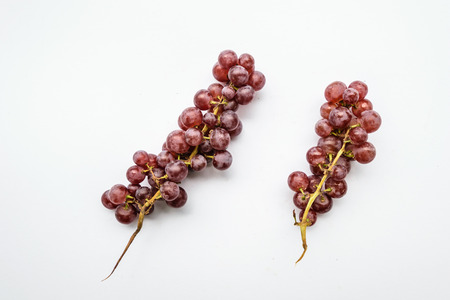 Purple grapes is isolated with white background, look liked fresh fruit for eating,high vitamins for Health.の写真素材