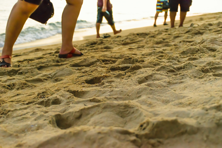 beach walk with sunset background,walk on sea beach on happy holidayの写真素材