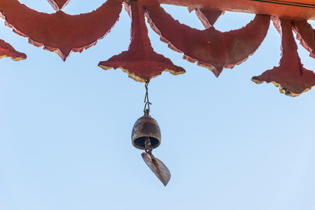 Bell metal hanging in temple Thailand, with blue sky.の写真素材