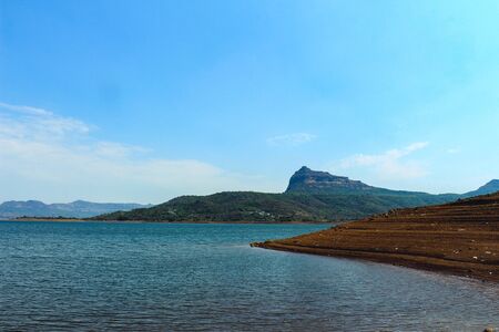 Landscape of the biggest lake in India, with mountains in the backgroundの写真素材