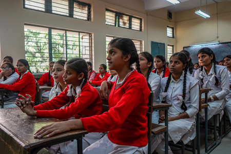 New Delhi, Delhi/ India- June 1 2020: Girl in government school looking towards the blackboard, listening to the teacher very attentively.のeditorial素材