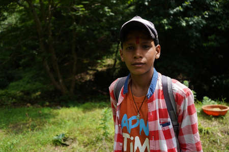 ALMORA, INDIA - SEPTEMBER 06, 2020: Portrait of a pahadi boy with tilak on his forehead. Fun and happy concept.のeditorial素材