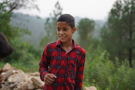 ALMORA, INDIA - SEPTEMBER 06, 2020: Portrait of a pahadi boy with tilak on his forehead. Fun and happy concept.のeditorial素材