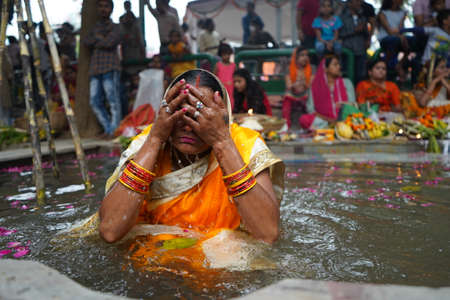 New Delhi, Delhi/ India- October 24 2020 : Women of India celebrating Chhath Pooja by drowning...