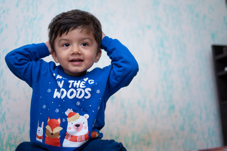 Portrait of a young indian infant kid with innocent eyes.の写真素材