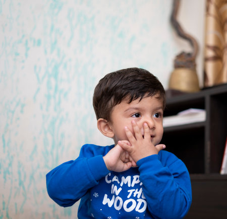 Portrait of a young indian infant kid with innocent eyes.の写真素材
