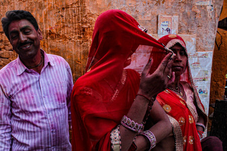 Mathura, Uttar Pradesh, India- January 6 2020: People playing holi in the holy state of mathura in the month of March. Celebrating holi by playing with colors with their friends and family.のeditorial素材