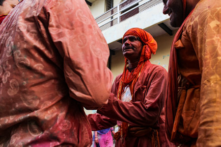 Mathura, Uttar Pradesh, India- January 6 2020: People playing holi in the holy state of mathura in the month of March. Celebrating holi by playing with colors with their friends and family.のeditorial素材