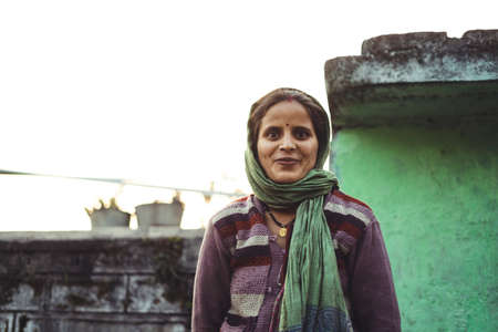 Almora, Uttrakhand - March 2 2021:- Portrait of a woman living in the rural india. Smiling into the camera. Travel portrait.のeditorial素材