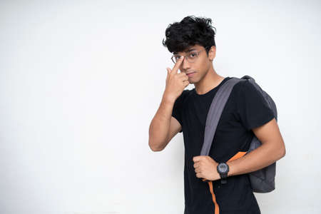 Young Indian college student getting ready for college after university open after lockdown.の写真素材