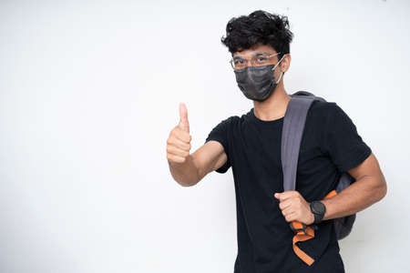 Young Indian college student getting ready for college after university open after lockdown.の写真素材