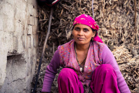 Moradabad, Uttar Pradesh- January 12 2022- Portrait of a village woman working in jaggery factory in Gad Mukteshwar.のeditorial素材