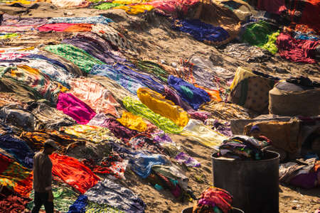 Agra, Uttar Pradesh - 28 January 2022- An aerial view of a dhobi ghat based in agra.Colorful clothes lying on the ground of dhobi ghat.のeditorial素材