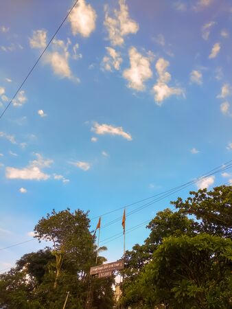 A photo of beautiful blue sky with cloud.and green nature.picture from india.の写真素材