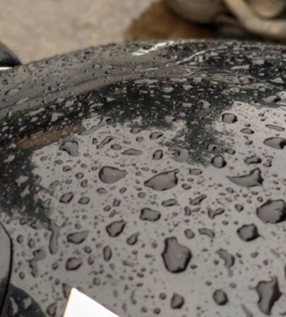A closeup photo of rain drops on bike.surface.A picture clicked at India.の写真素材