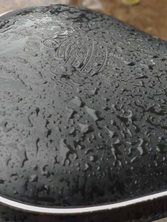 A closeup photo of rain drops on bike.surface.A picture clicked at India.の写真素材