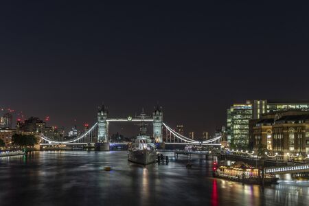The Millenium Bridge and St Paul's Cathedral Illuminated in the Blue Hour