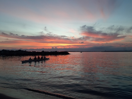 An amazing caption of small waves and beautiful sunset with an incredible reflection over the sea...