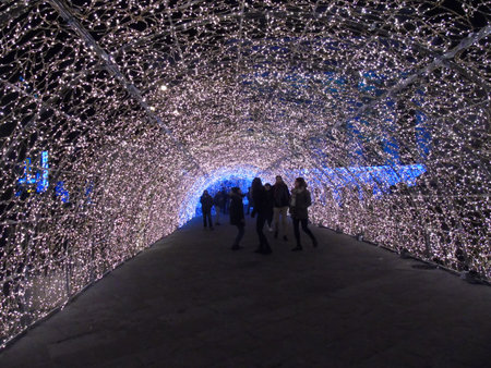 Genova, Italy - 12/15/2018:An amazing christmas decoration lights on the streets of Genova in winter with an artistic background and some people enjoing the momentのeditorial素材