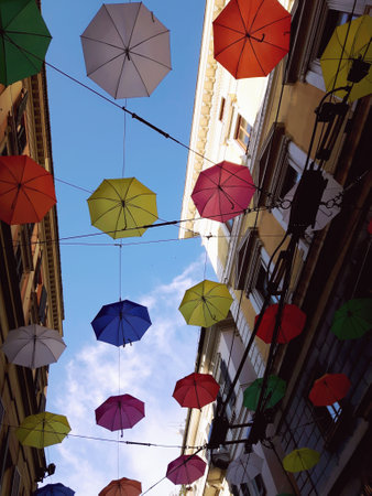 Genoa, Italy - 04/06/2019: Rainbow gay pride protection symbol in hanging umbrellas over the cityのeditorial素材