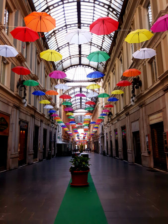 Genoa, Italy - 04/06/2019: Rainbow gay pride protection symbol in hanging umbrellas over the cityのeditorial素材