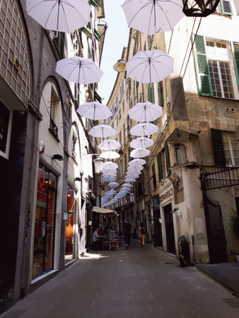 Genoa, Italy - 04/06/2019: Rainbow gay pride protection symbol in hanging umbrellas over the cityのeditorial素材